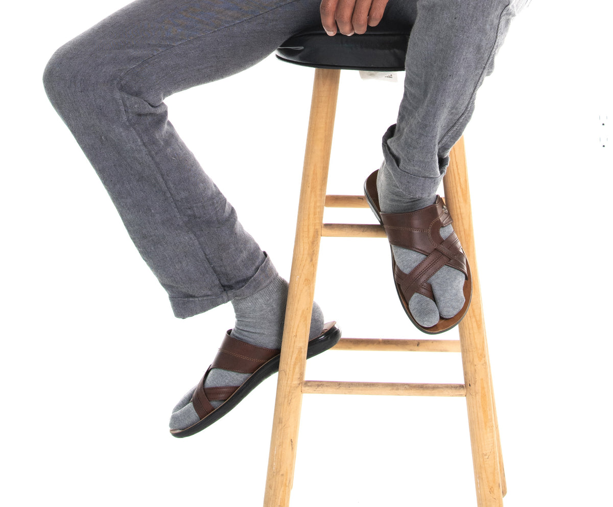 Grey V-Toe athletic split-toe tabi mini-crew socks styled on a stool
