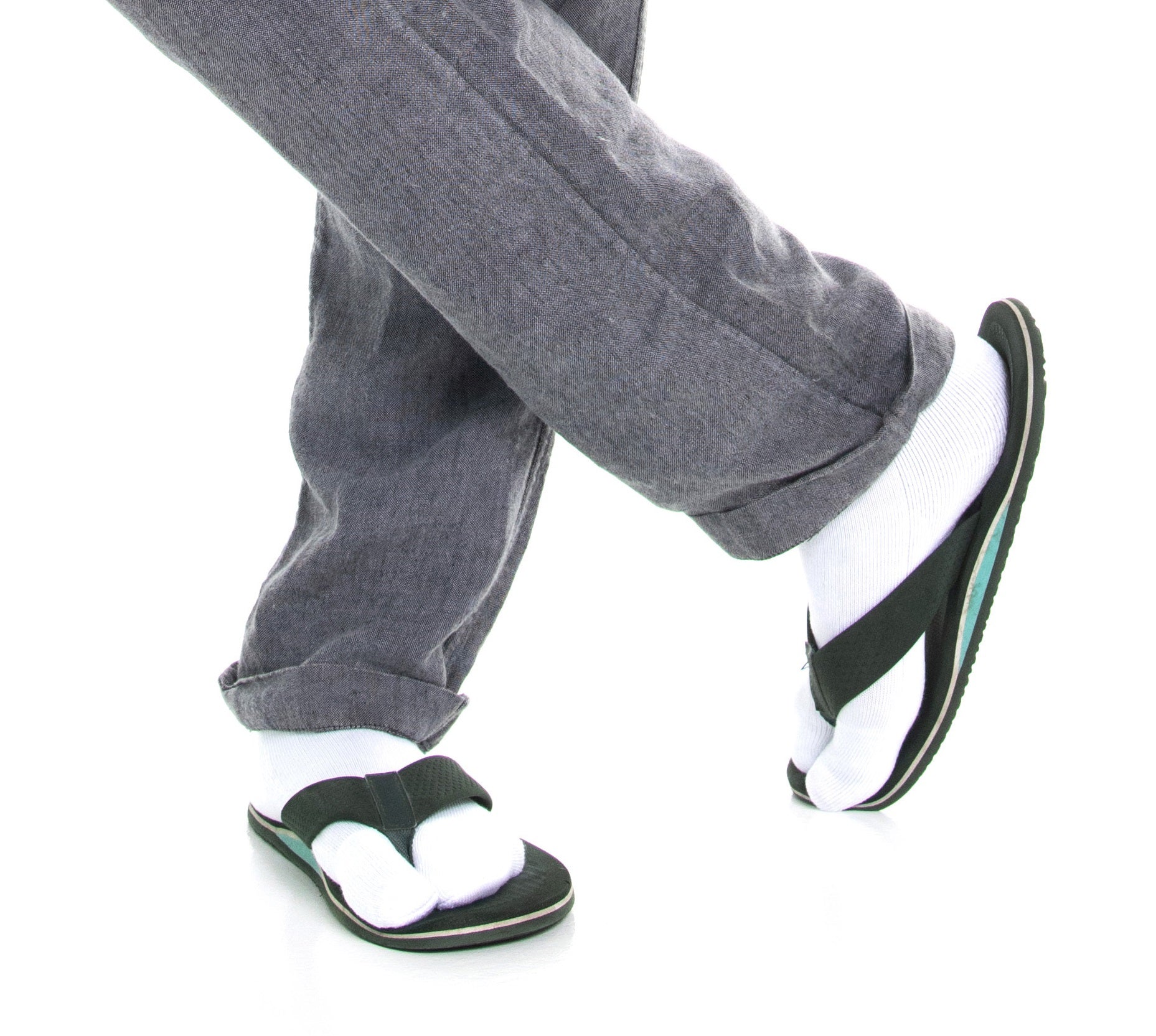 Close-up of white V-Toe athletic split-toe tabi mini-crew socks worn on the feet