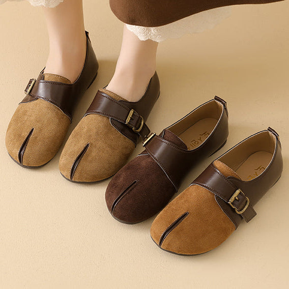 Four traditional Japanese tabi-style flat shoes in brown and tan suede and leather, shown with a model's legs wearing a pair, on a warm beige background.