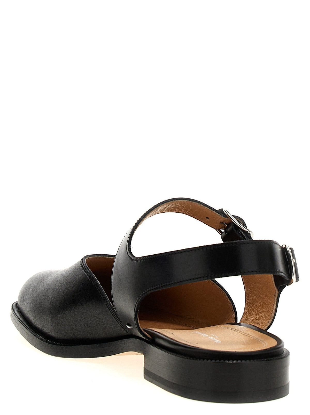 A black leather Mary Jane Tabi sandal with an ankle strap and buckle, shown from a rear three-quarter angle on a white background.